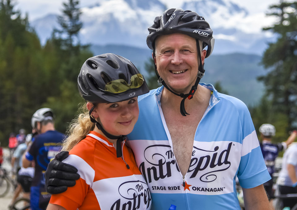 A father and daughter smile in the Gran Fondo sunshine in Whistler, BC